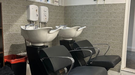Modern wash station at Serenity Hair & Beauty, Alcester, England, GB, highlighting sleek design and comfort.