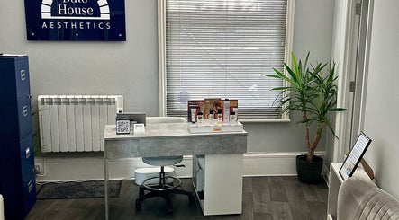 Reception area at Bute House Aesthetics, Newmarket, England, GB with a welcoming desk and decor.