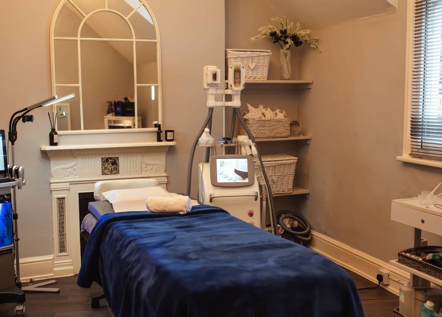 Calming treatment room at Bute House Aesthetics, Newmarket, England, GB featuring a modern facial machine.