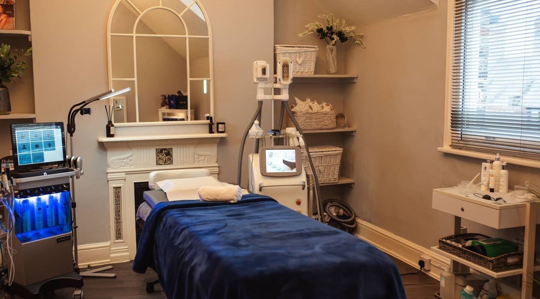 Calming treatment room at Bute House Aesthetics, Newmarket, England, GB featuring a modern facial machine.