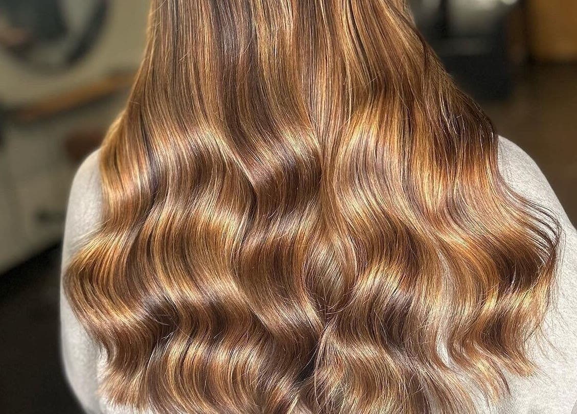 Glossy brunette curls styled at Calum Maguire Hairdressing in Ayr, Scotland, GB.