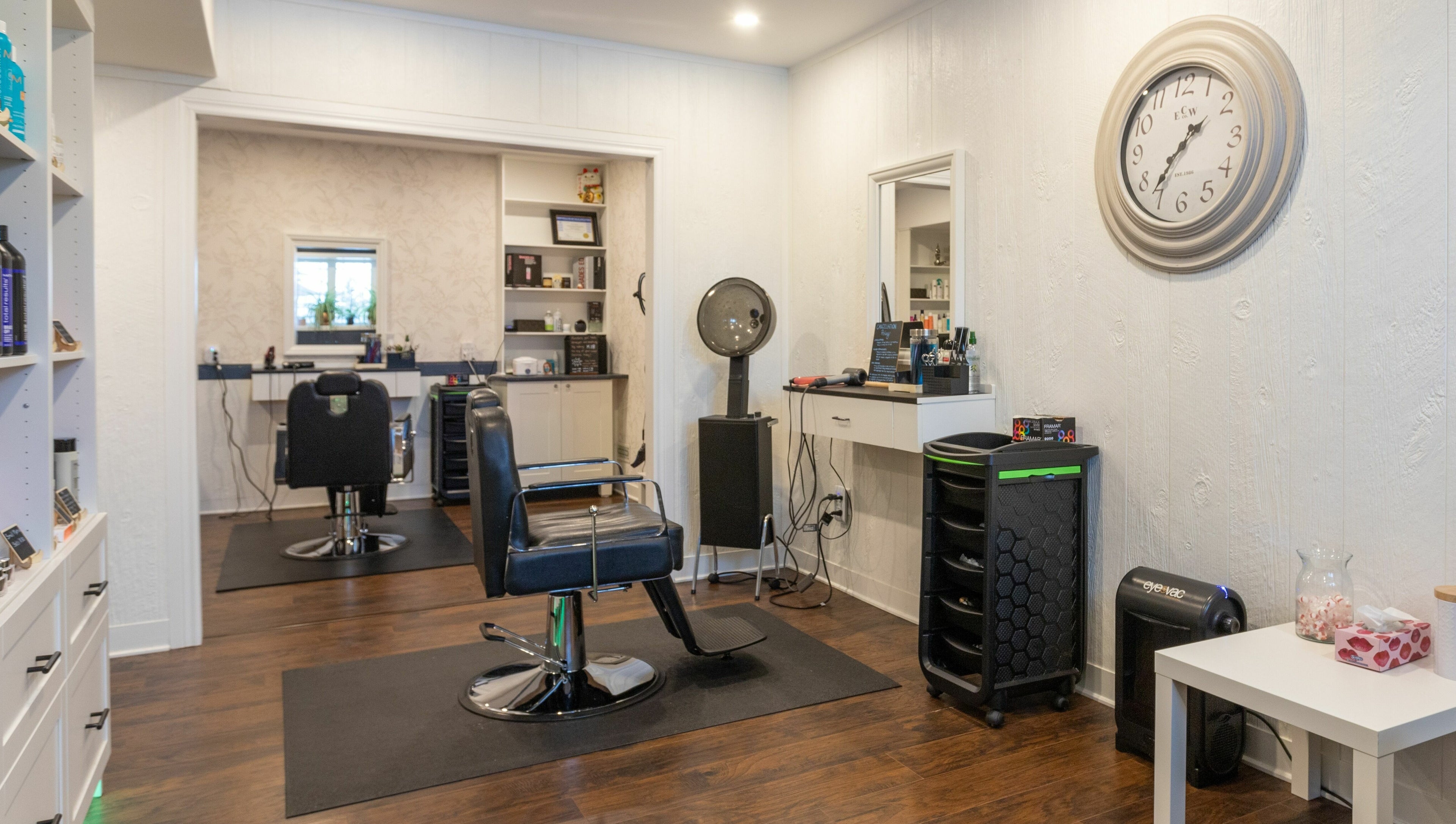 Interior of Erin’s Hair Design in Bradford West Gwillimbury, showcasing modern salon chairs and equipment.