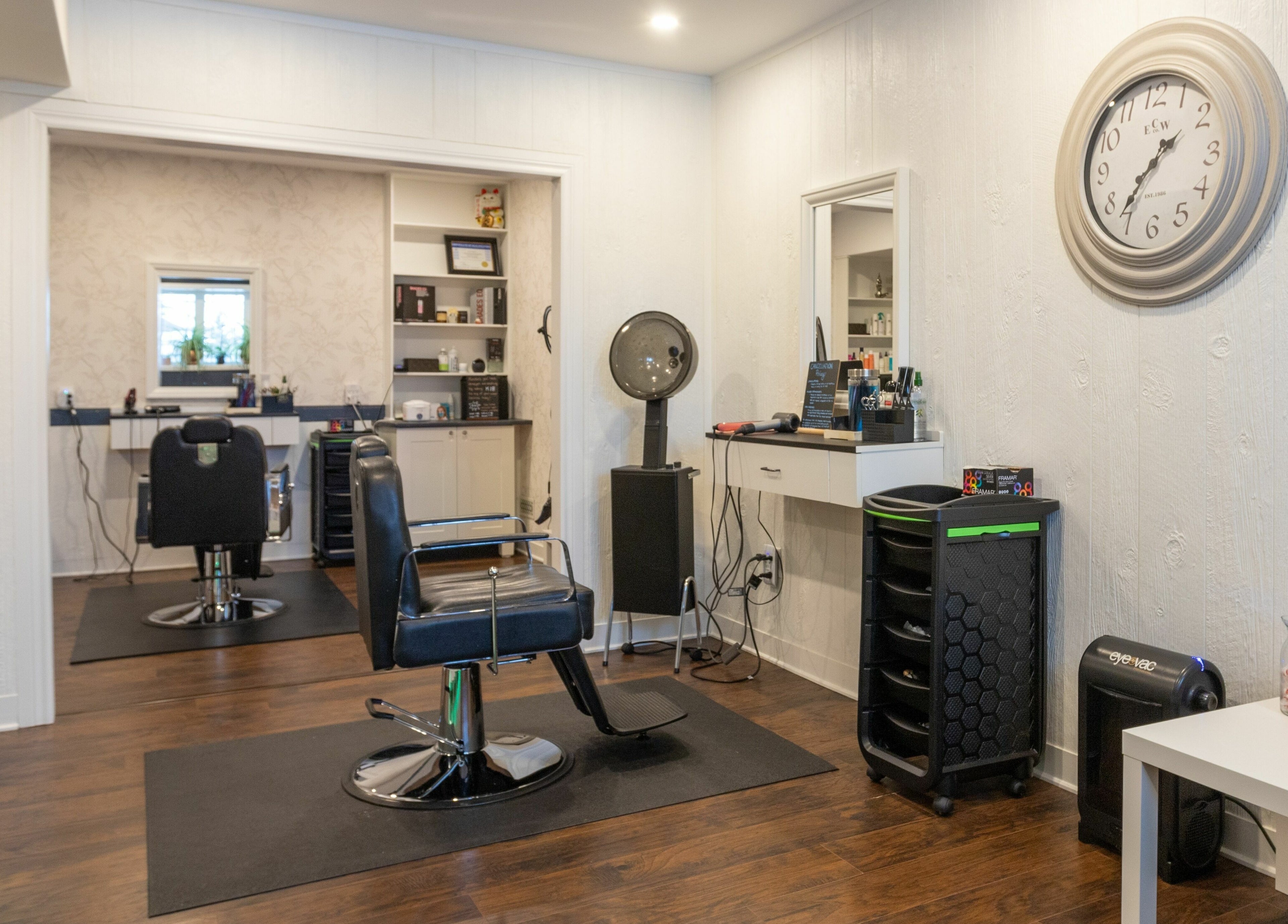 Interior of Erin’s Hair Design in Bradford West Gwillimbury, showcasing modern salon chairs and equipment.