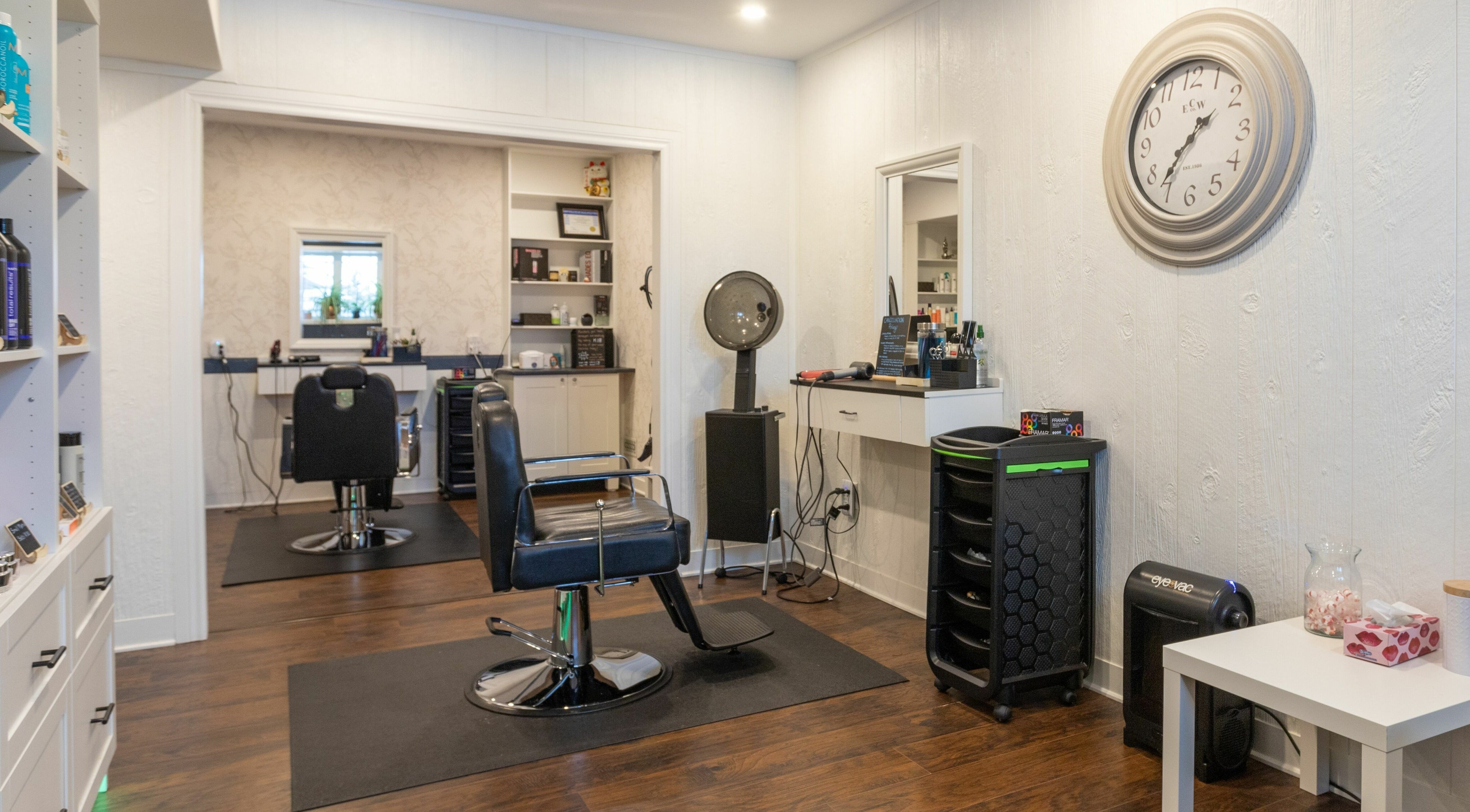 Interior of Erin’s Hair Design in Bradford West Gwillimbury, showcasing modern salon chairs and equipment.