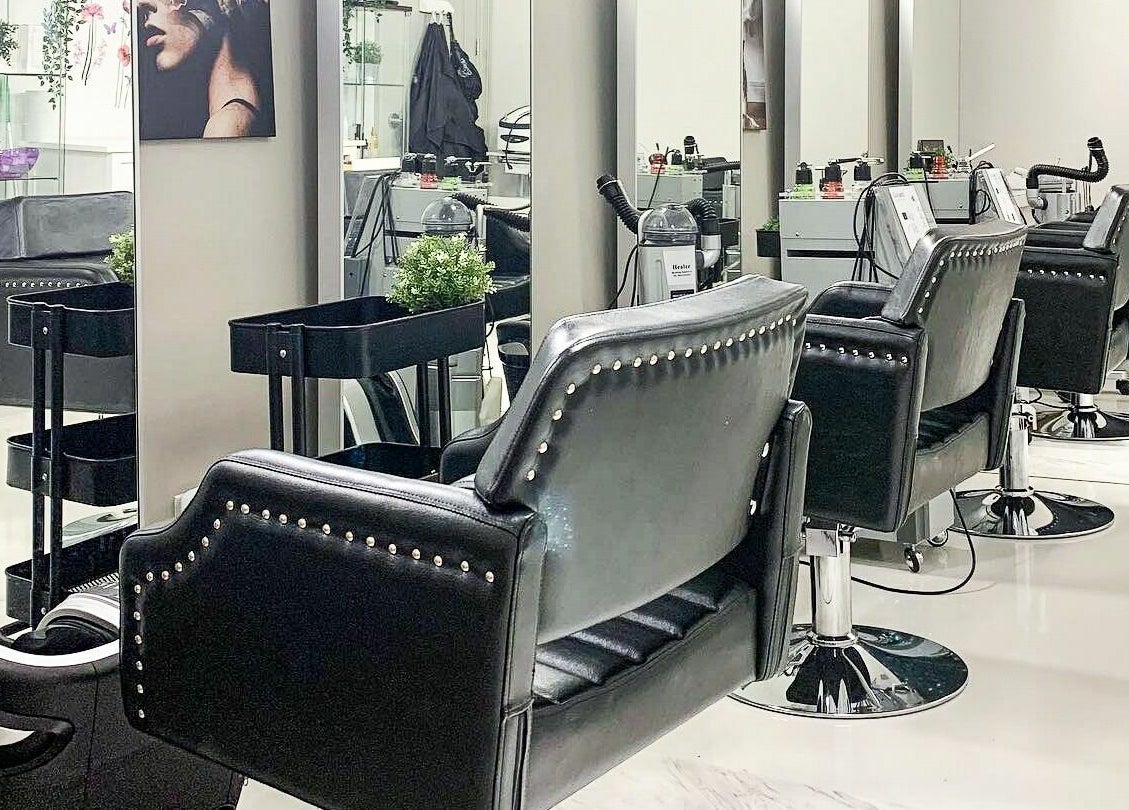 Elegant salon chairs at Odjibik Vaughan, a beauty venue in Vaughan, Ontario, CA, showcasing modern luxury.