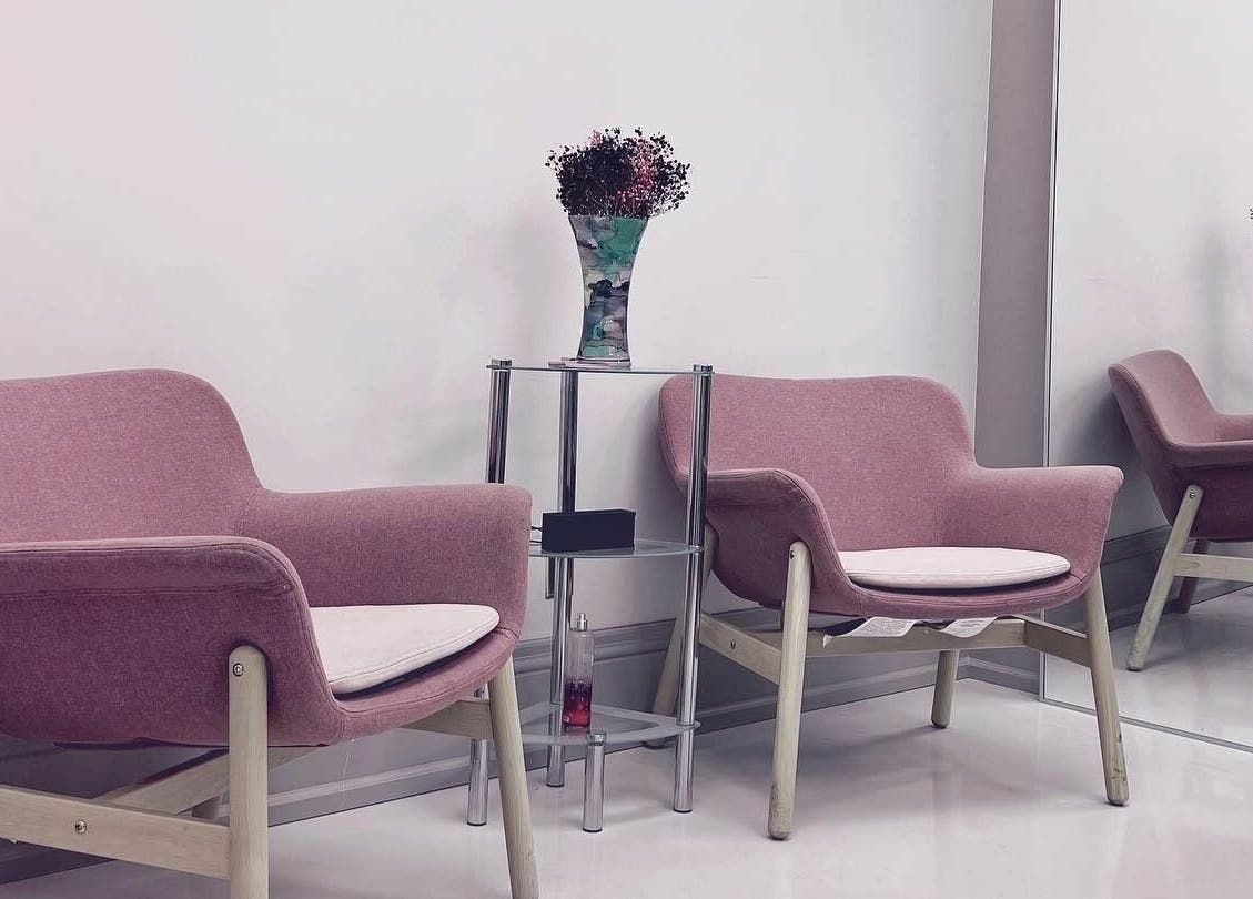Cozy waiting area with pink chairs at Odjibik Vaughan, Vaughan, Ontario, CA.