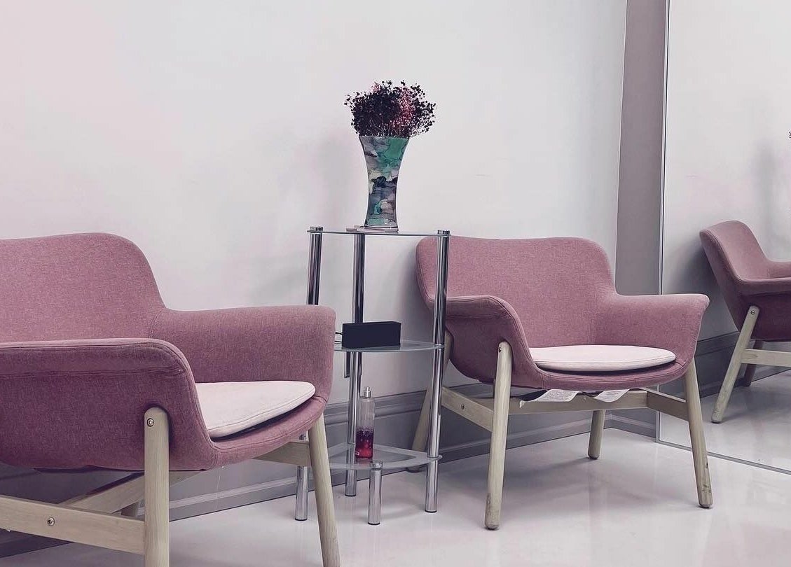 Cozy waiting area with pink chairs at Odjibik Vaughan, Vaughan, Ontario, CA.