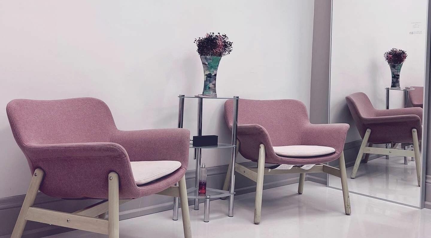 Cozy waiting area with pink chairs at Odjibik Vaughan, Vaughan, Ontario, CA.