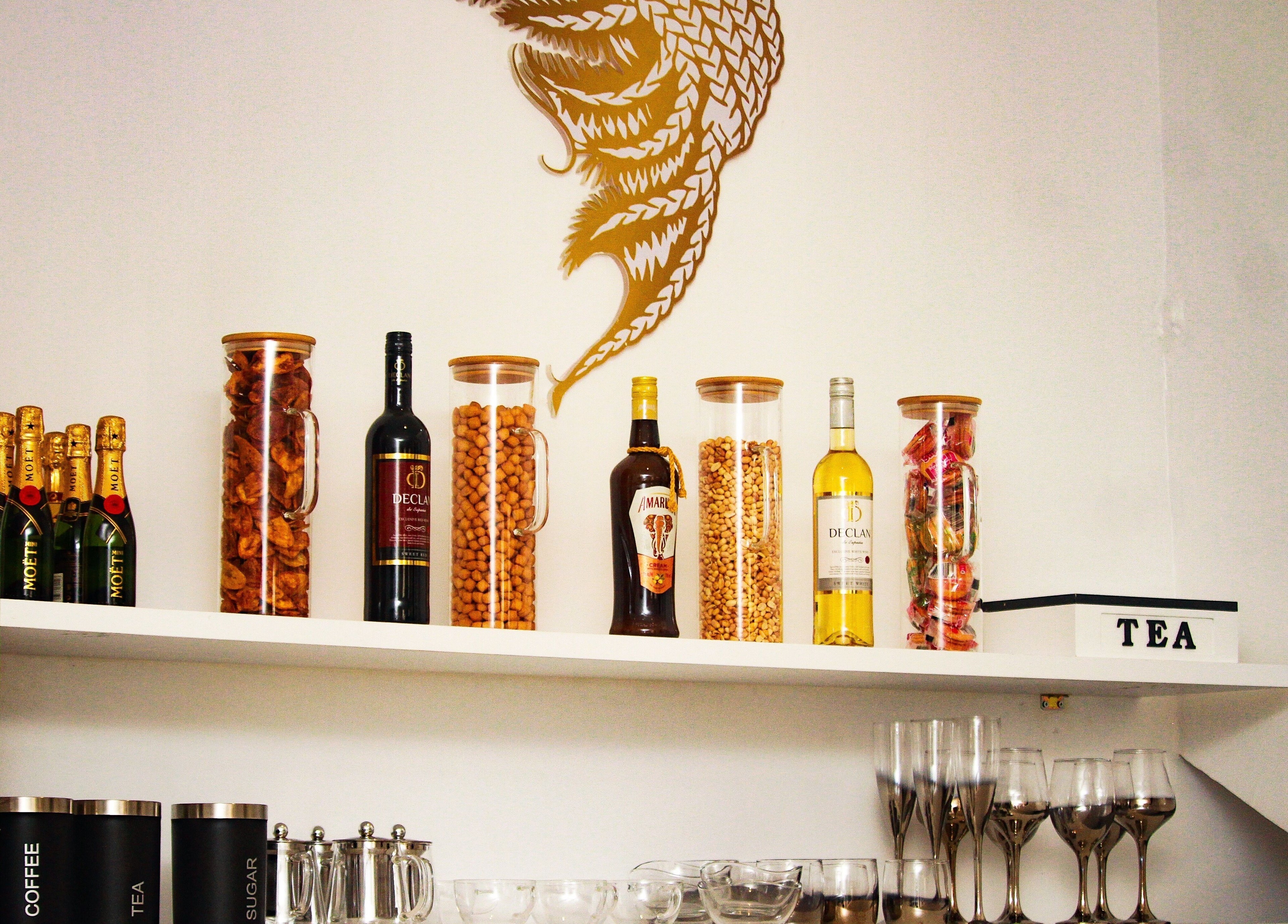 Chic beverage display at The Braiding Vault, Lekki, Lagos, NG with assorted drinks and nuts.
