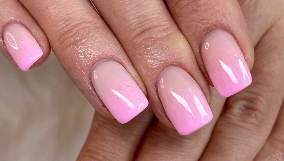 Elegant pink ombre manicure at Nanda Nails & Beauty, Bay Of Plenty, NZ, showcasing trendy nail design.