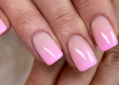 Elegant pink ombre manicure at Nanda Nails & Beauty, Bay Of Plenty, NZ, showcasing trendy nail design.