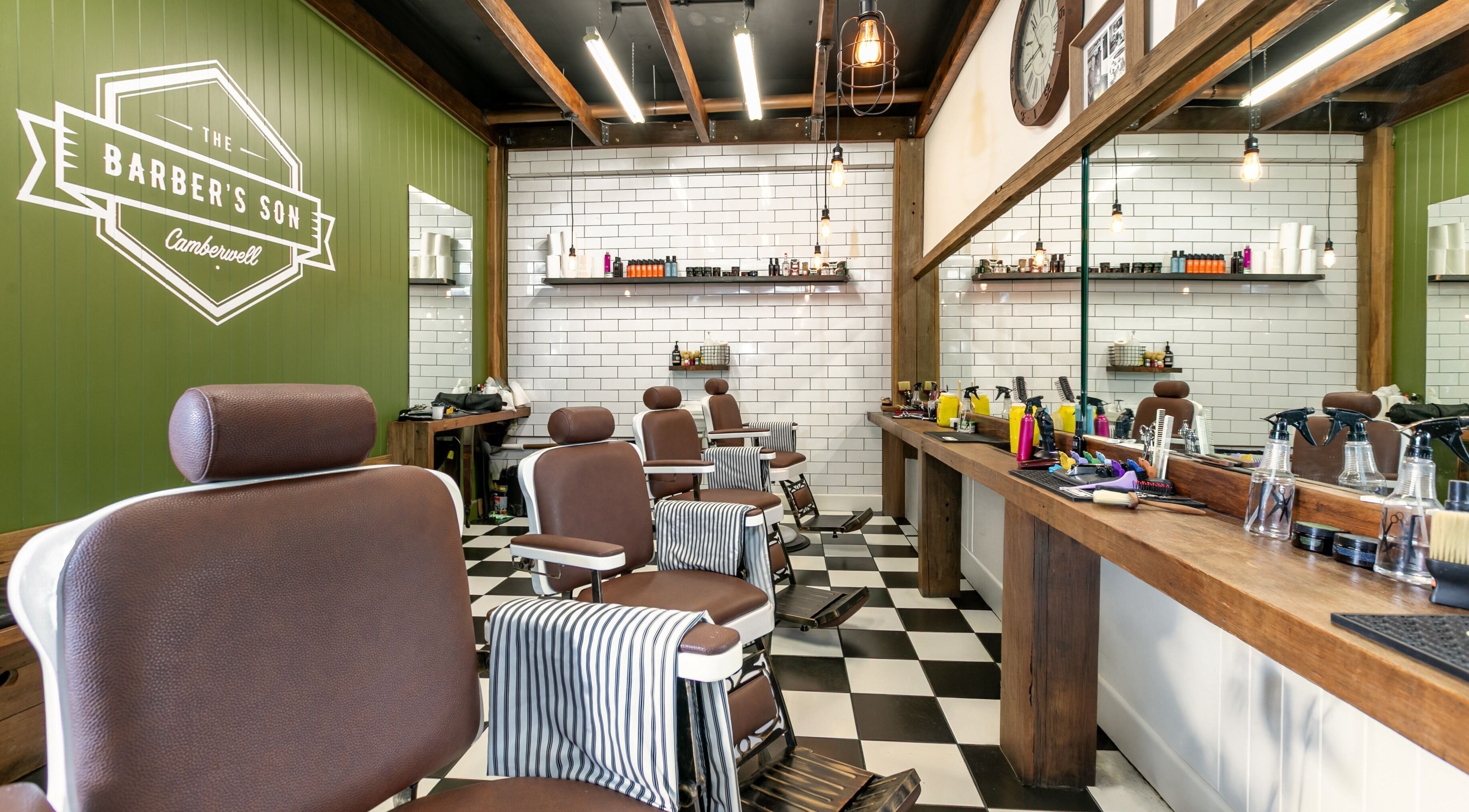 The Barbers Son Camberwell in Melbourne, Victoria, AU features classic barber chairs and stylish decor.
