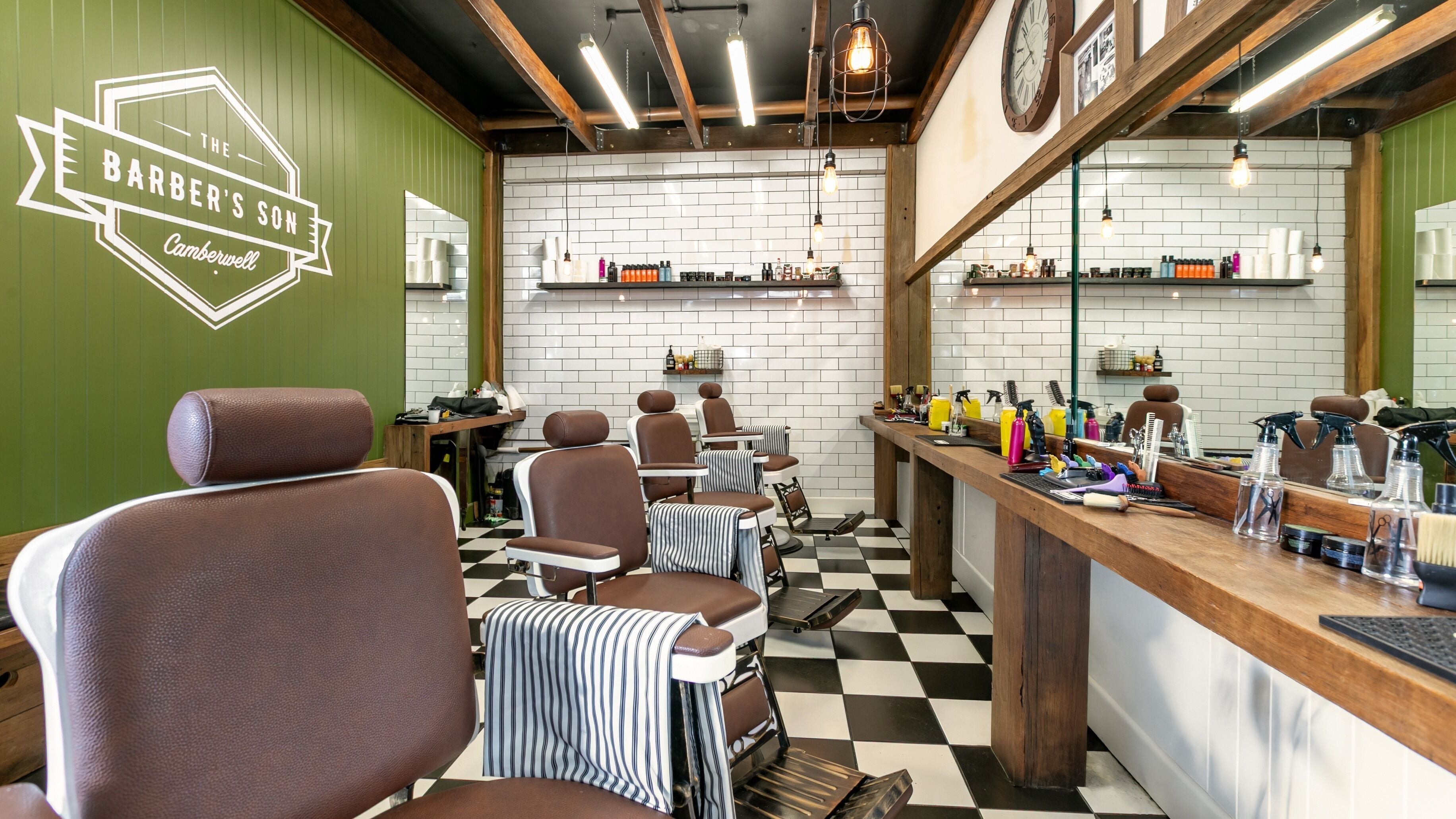 The Barbers Son Camberwell in Melbourne, Victoria, AU features classic barber chairs and stylish decor.