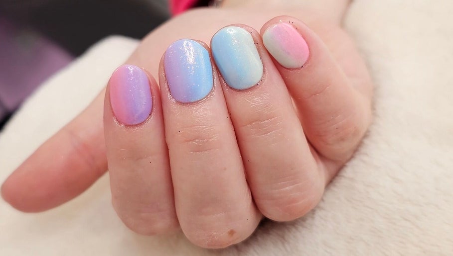 Pastel nail art at The Nail And Beauty Shed in Bryngwran, Cymru, GB showcasing trendy gradient hues.