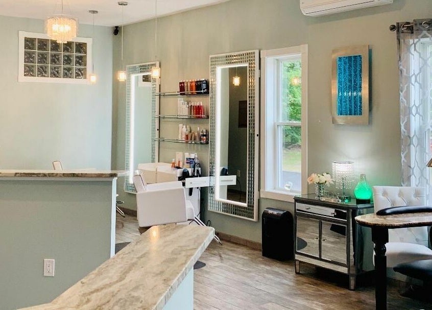 Modern, serene interior of Skin Deep Day Spa in Cumberland, Maine, US, featuring chic decor and bright lighting.