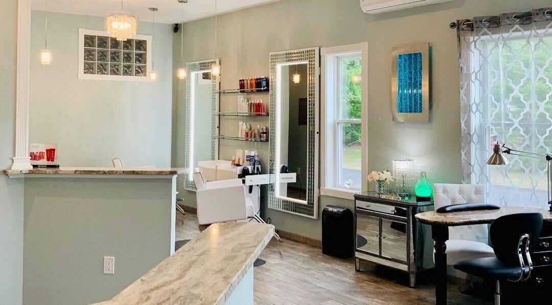 Modern, serene interior of Skin Deep Day Spa in Cumberland, Maine, US, featuring chic decor and bright lighting.