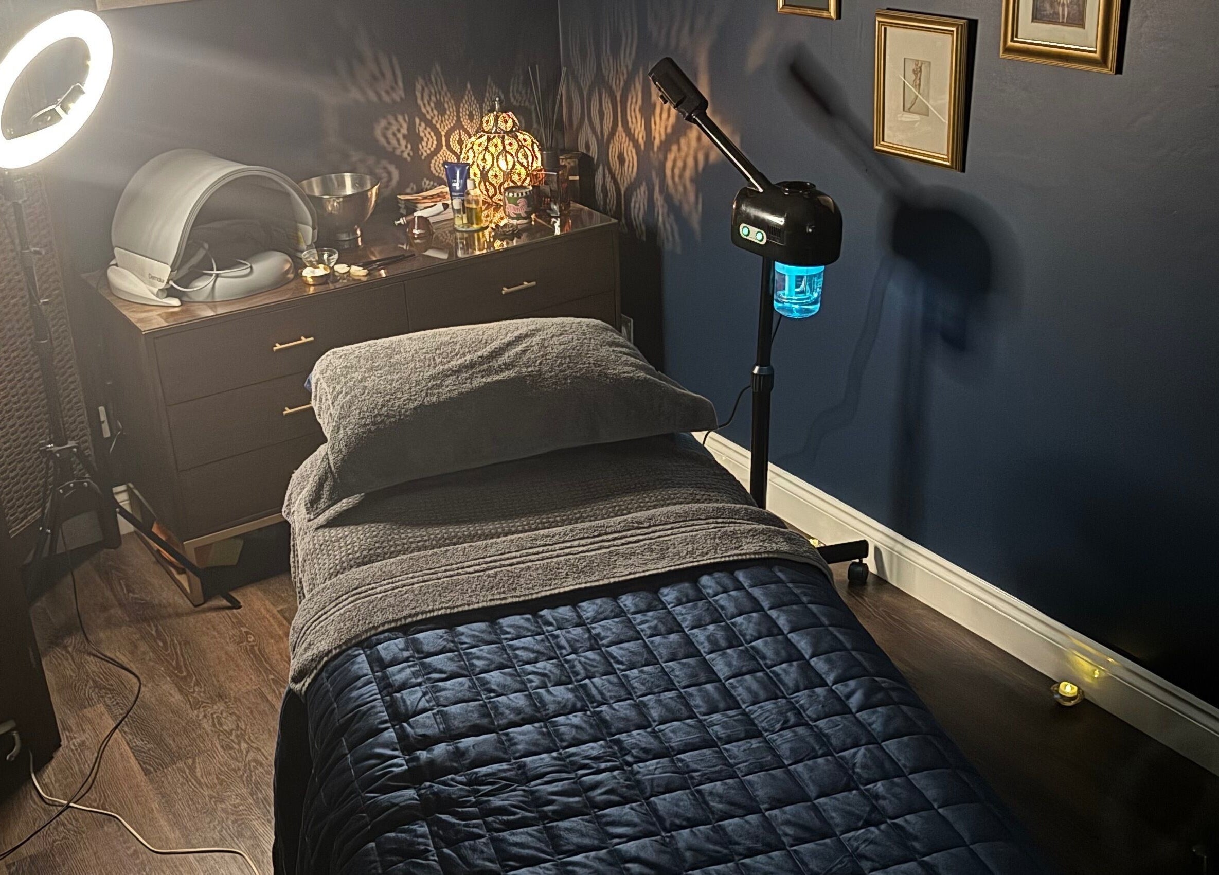 Cozy therapy room at Ritual in Glasgow, Scotland, GB, featuring soft lighting and a massage bed.