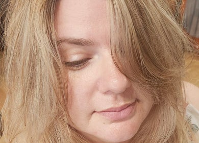 Client with soft blonde hairstyle at Rockin Rollers, Sierra Madre, California, US showcasing salon expertise.