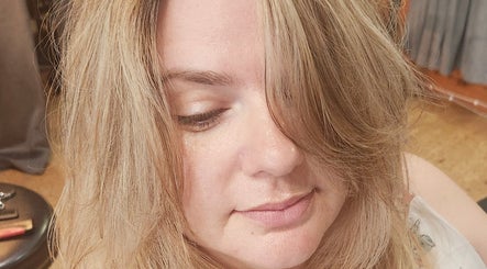 Client with soft blonde hairstyle at Rockin Rollers, Sierra Madre, California, US showcasing salon expertise.