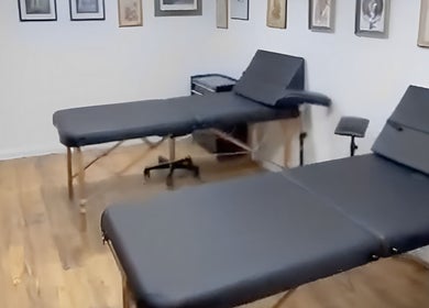 Tranquil massage room at Bodiology Sussex, Eastbourne, England, GB, featuring two massage tables.