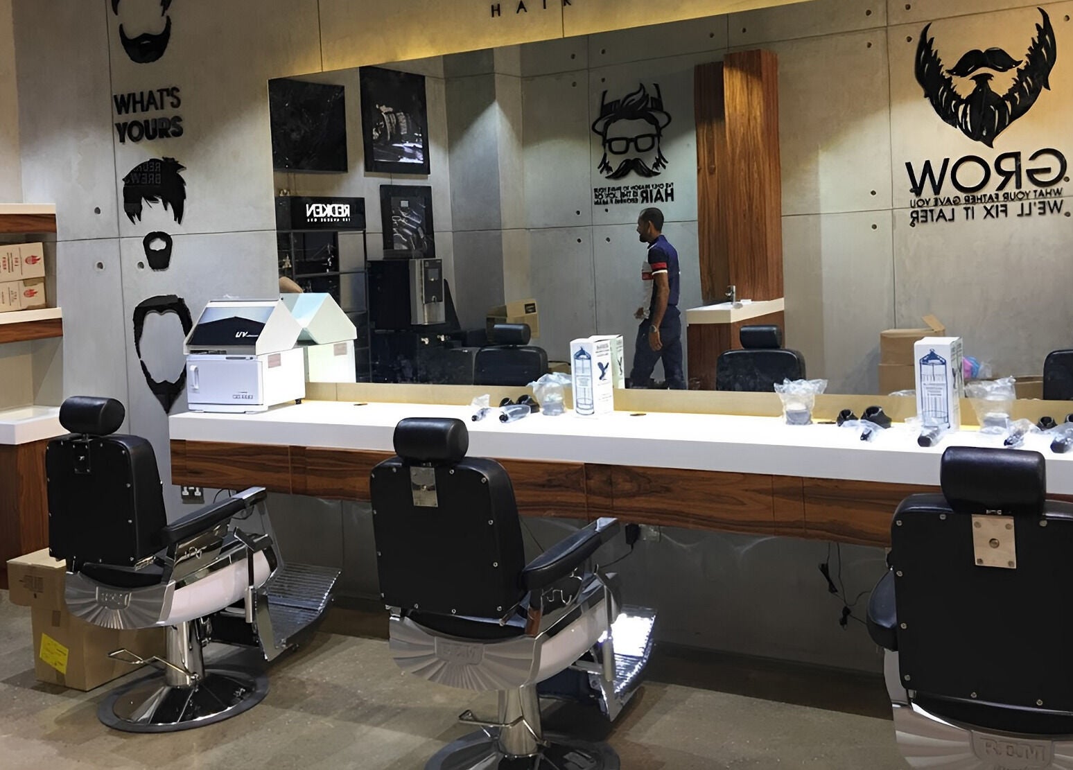 Stylish barber chairs at Rerotti Gents - Al Ghadeer, Abu Dhabi, AE with mirrors and grooming tools.