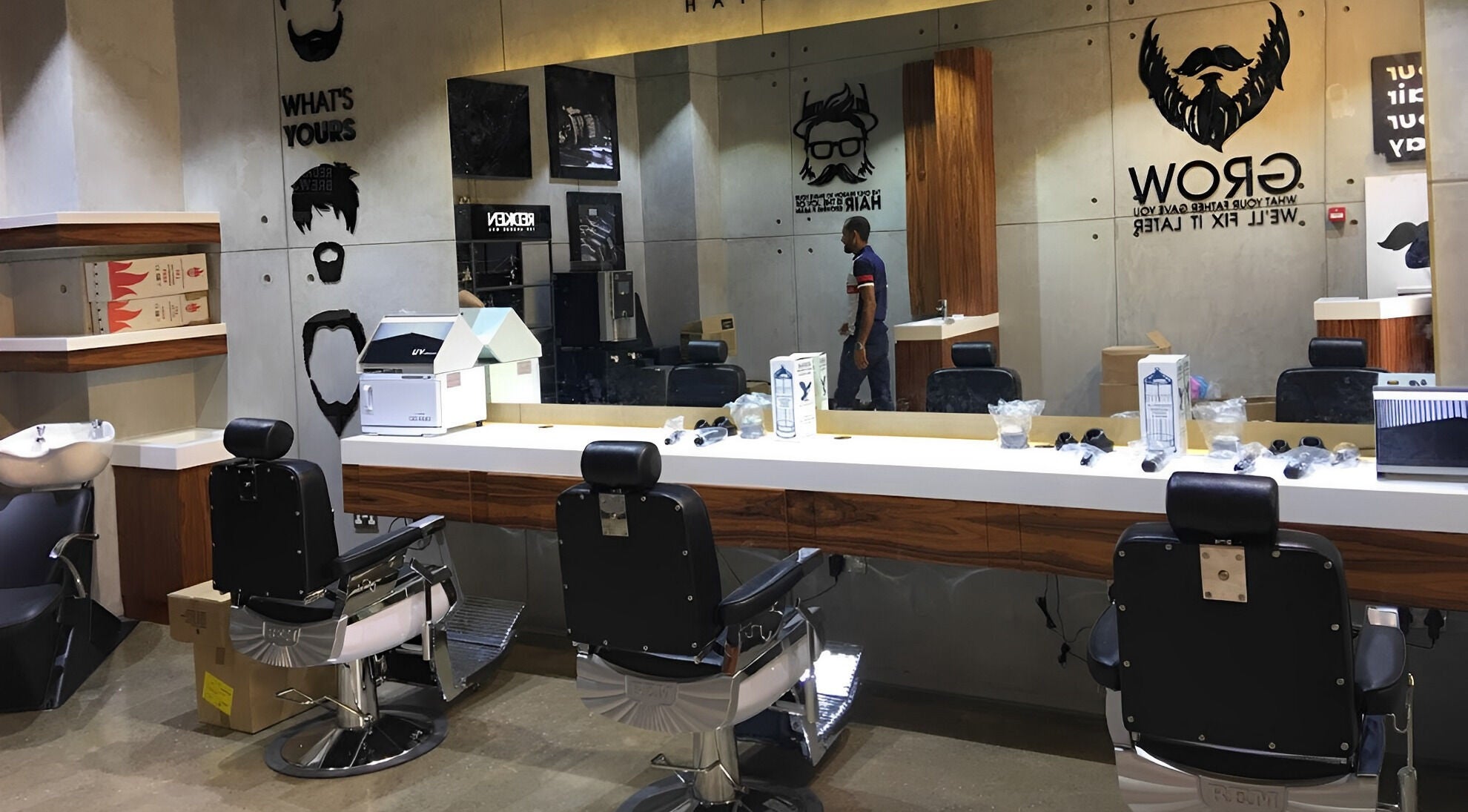 Stylish barber chairs at Rerotti Gents - Al Ghadeer, Abu Dhabi, AE with mirrors and grooming tools.