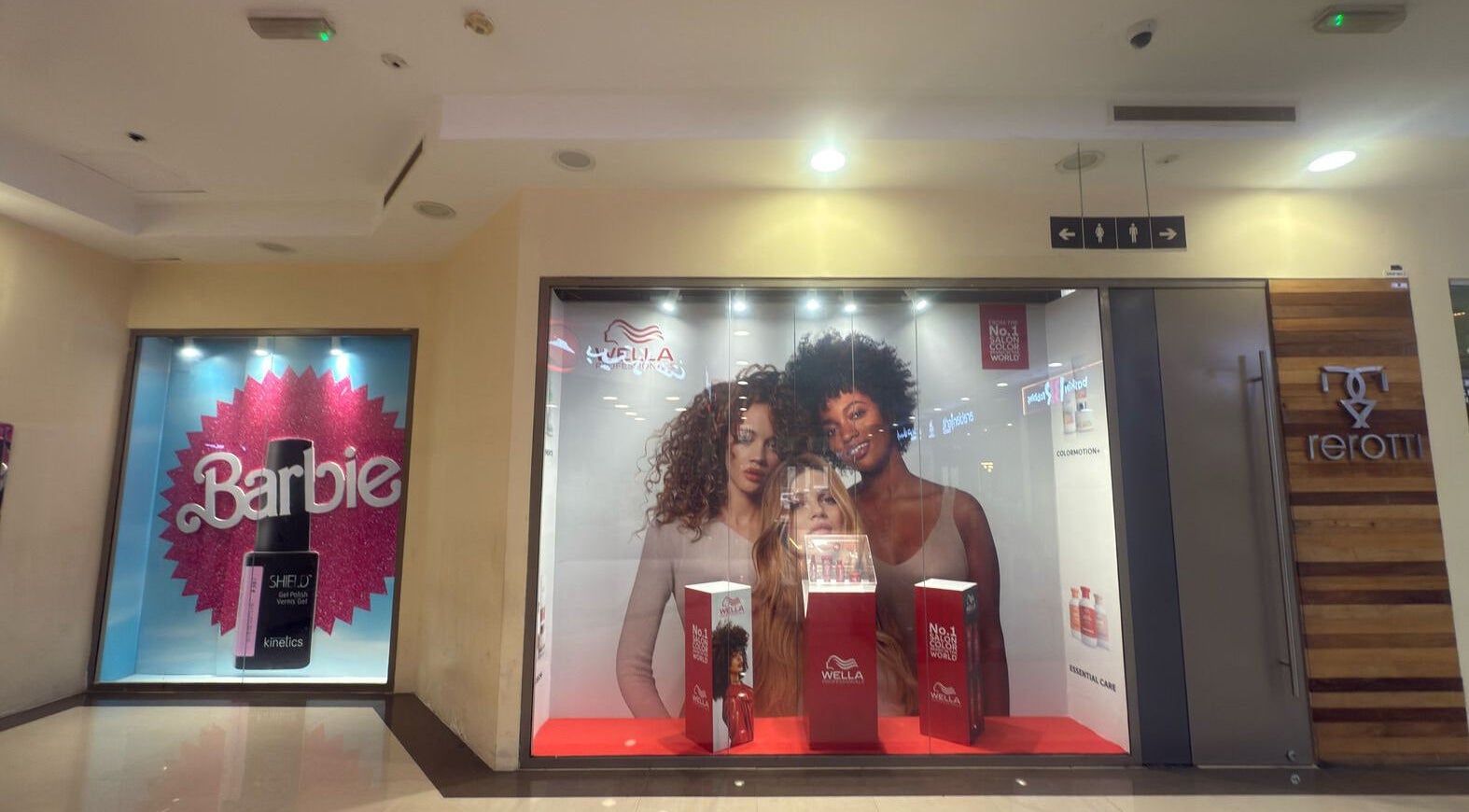 Salon entrance at Rerotti Hair and Beauty - Remraam, Dubai. Bold signage and vibrant hair product displays.