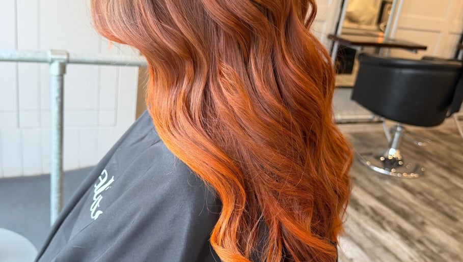 Vibrant red hair styled at Erin McQuitty Hair in Carrickfergus, England, GB salon.