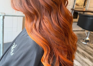 Vibrant red hair styled at Erin McQuitty Hair in Carrickfergus, England, GB salon.