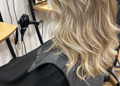 Blonde wavy hairstyle at Erin McQuitty Hair, Carrickfergus, England, GB salon chair setup.