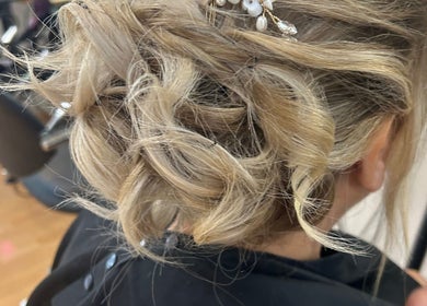 Elegant blonde updo hairstyle created at Erin McQuitty Hair in Carrickfergus, England, GB.