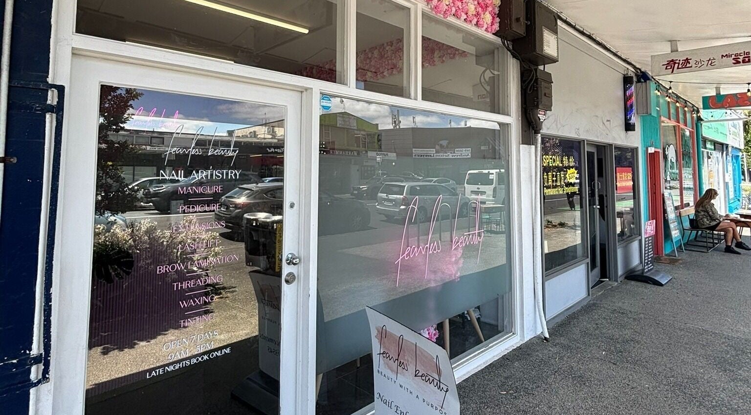 Entrance of Fearless Beauty in Auckland, NZ showcasing elegant window design and signage.