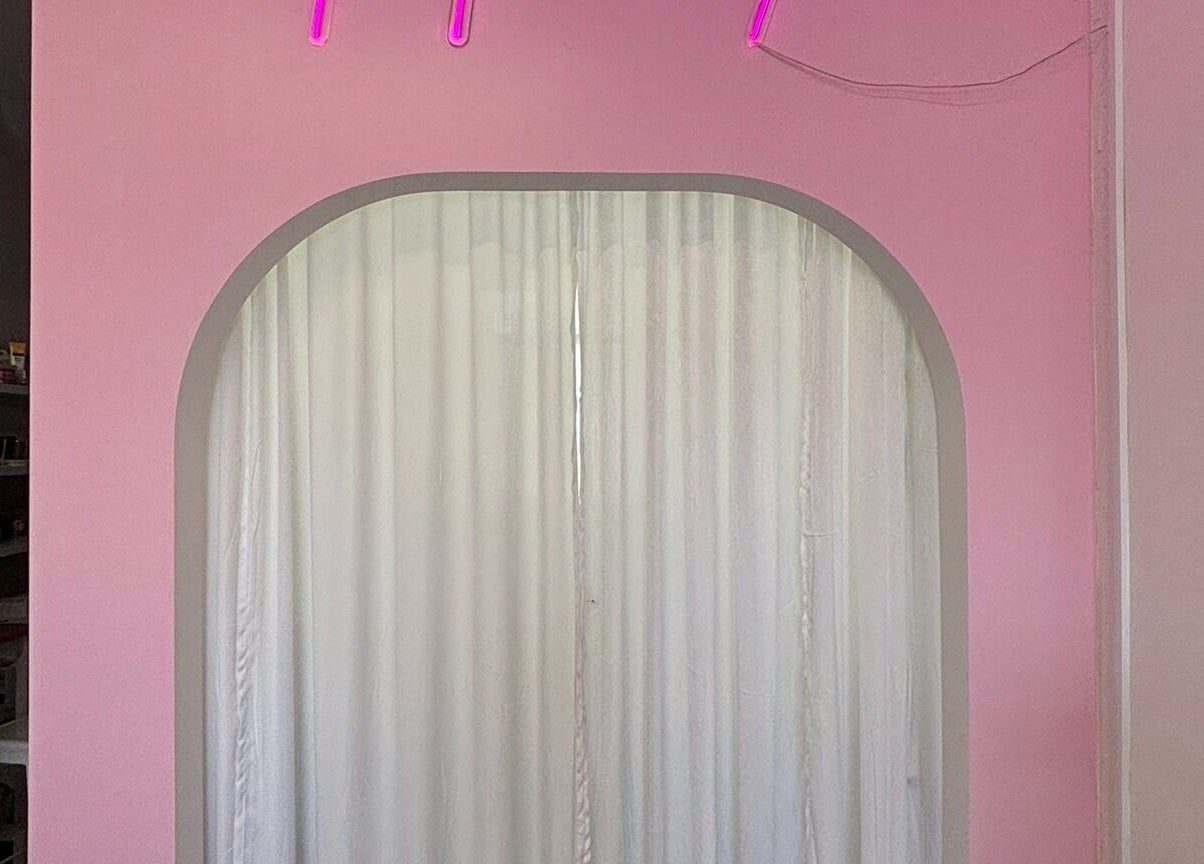 Stylish pink archway with curtains at Fearless Beauty, Auckland, Auckland, NZ creating a soothing ambiance.