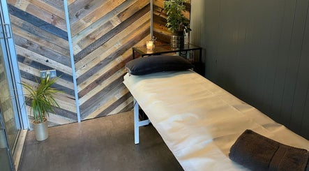 Cozy treatment room at Baliga Ayurveda & Skin Clinic in London, England, GB with soft lighting and minimalist decor.