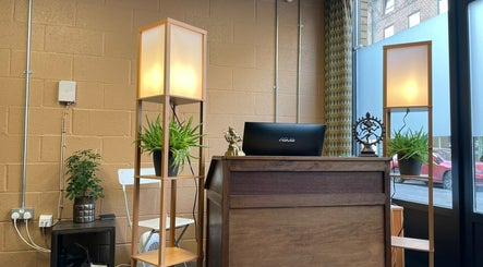 Reception area at Baliga Ayurveda & Skin Clinic in London, England, GB with plants and soft lighting.