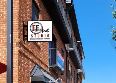 Exterior of 541 William St., Fredericksburg, Virginia, US, featuring a fitness studio sign and brick facade.