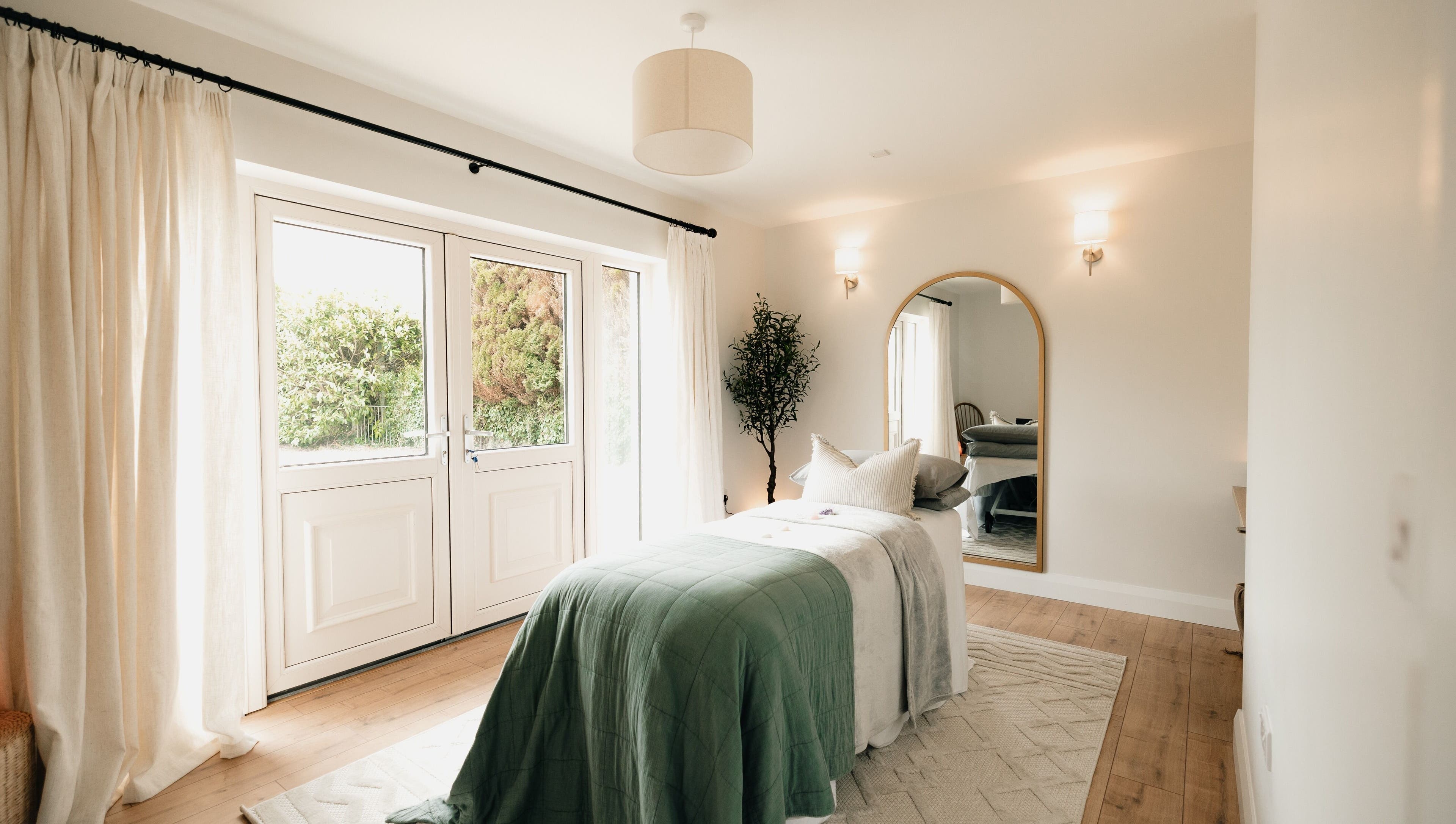 Serene treatment room at Sãno Wellness | Amy O Mara, Lisnagry, IE, featuring elegant decor and natural light.