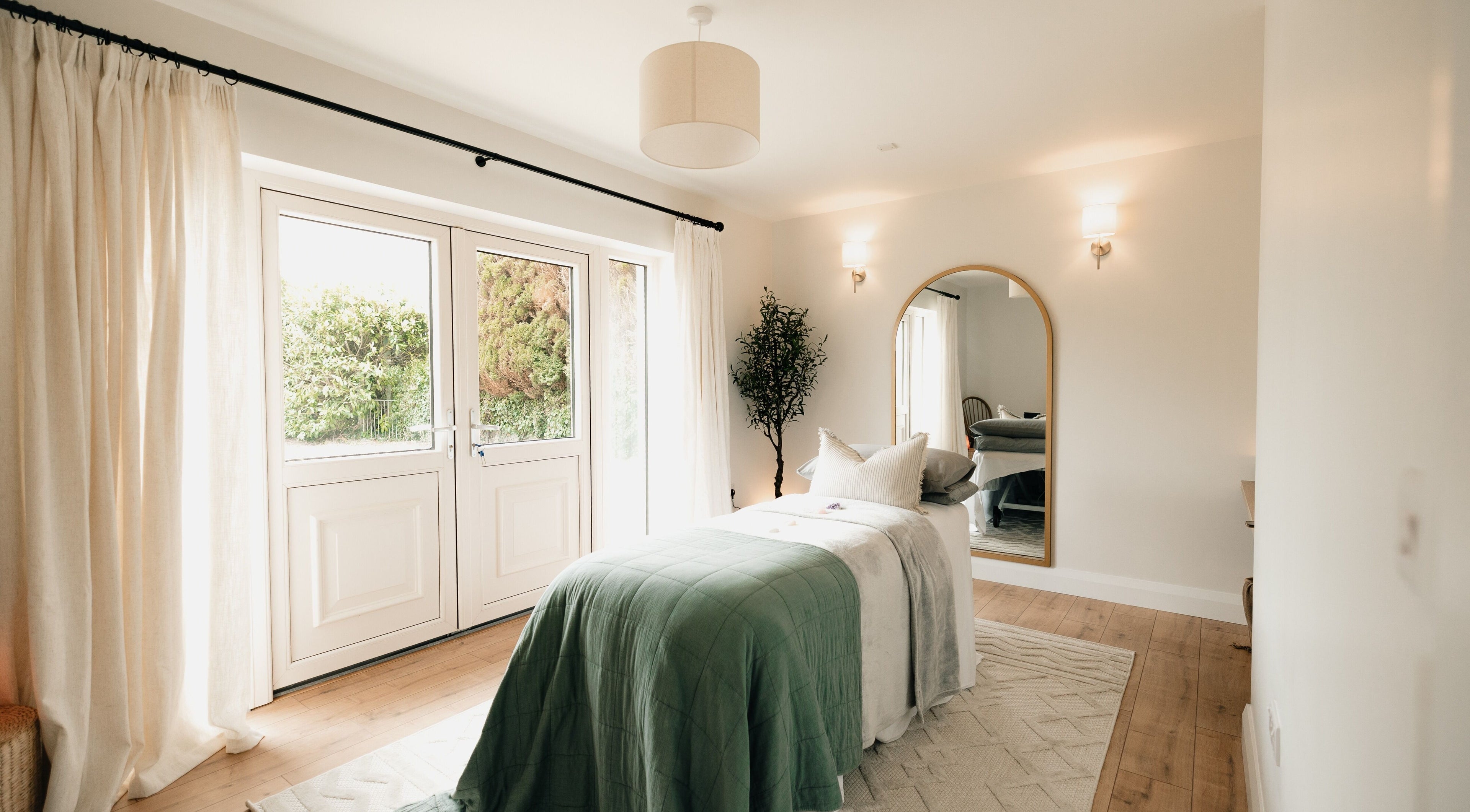 Serene treatment room at Sãno Wellness | Amy O Mara, Lisnagry, IE, featuring elegant decor and natural light.