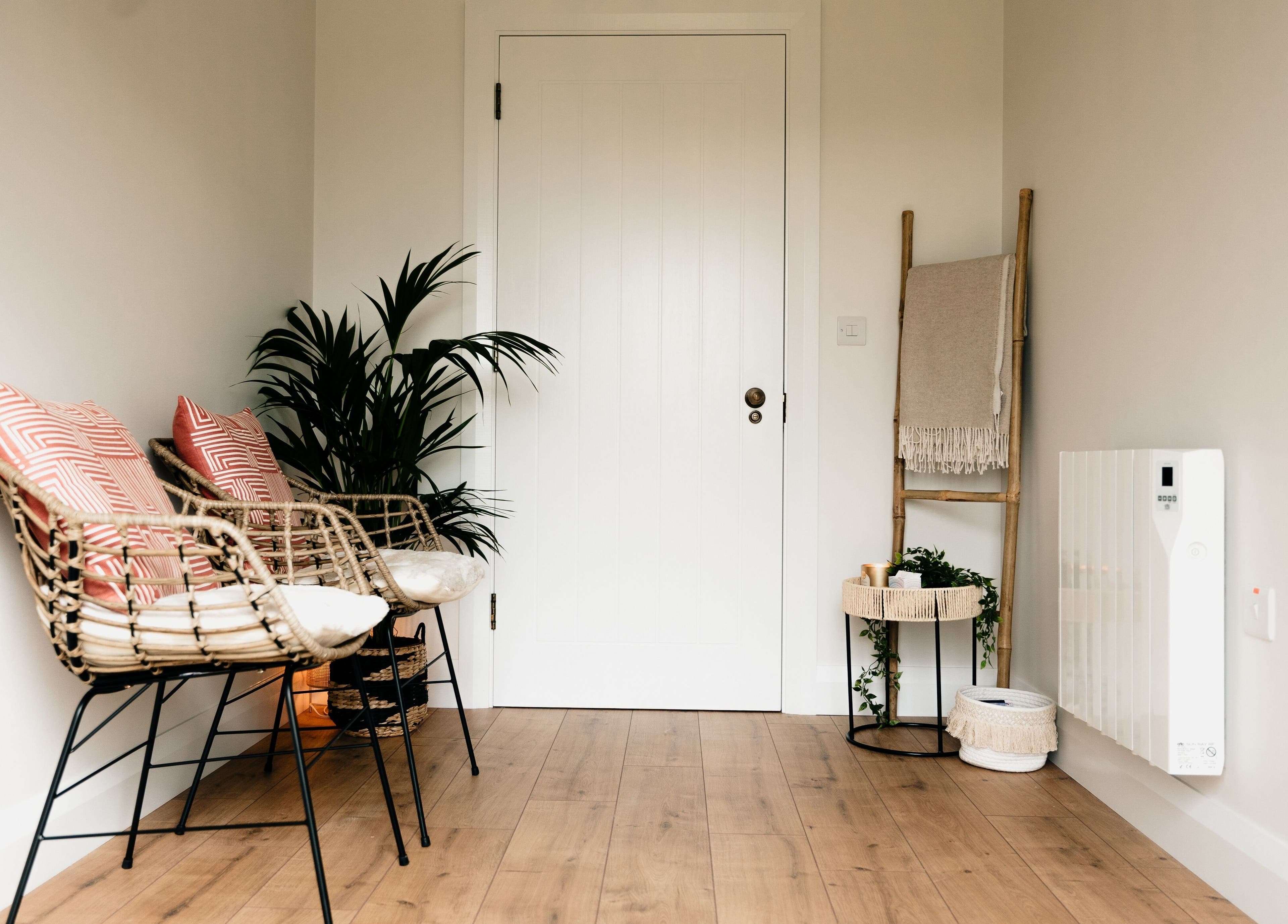 Inviting seating at Sãno Wellness | Amy O Mara in Lisnagry, IE with rattan chairs and decor.