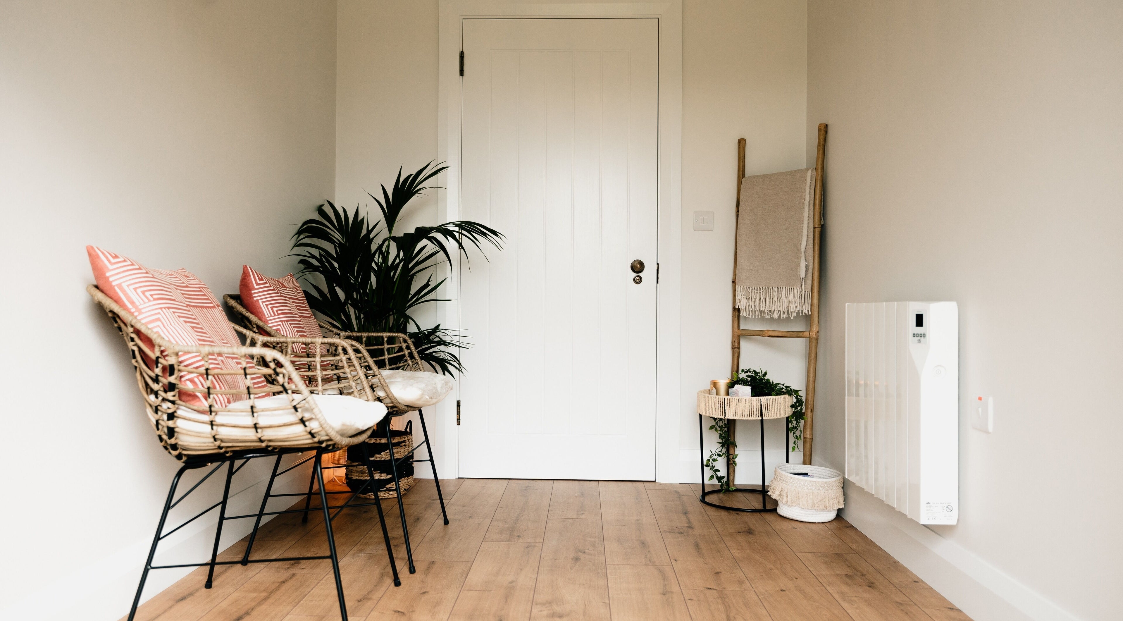 Inviting seating at Sãno Wellness | Amy O Mara in Lisnagry, IE with rattan chairs and decor.