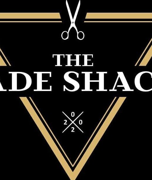 Logo of The Fade Shack Strandfontein in Cape Town, Western Cape, ZA featuring a stylized triangle with scissors.