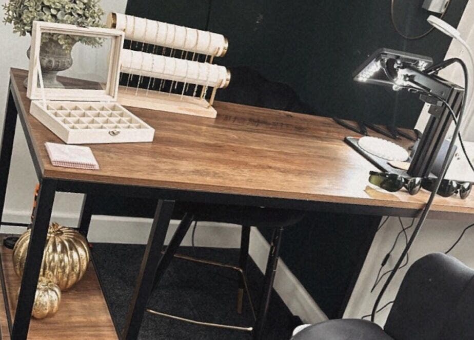 Elegant beauty workspace at Daisy Chains, Willoughby, England, GB with wooden desk and stylish decor.