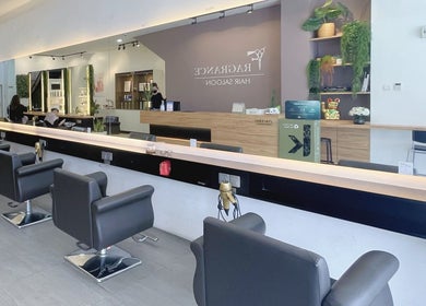 Stylish interior of Fragrance Hair Saloon in Cheras, Selangor, MY showcasing modern black salon chairs.