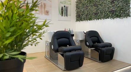 Modern salon chairs and lush decor at Fragrance Hair Saloon, Cheras, Selangor, MY.