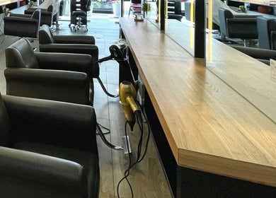 Stylish salon chairs at Fragrance Hair Saloon, Cheras, Selangor, MY, displaying a modern beauty space.