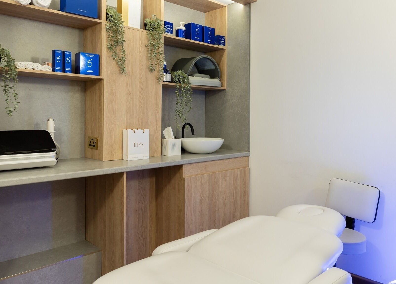 Modern treatment room at INIYA Aesthetics & Laser Clinic, Stanmore, England, GB, featuring sleek decor.