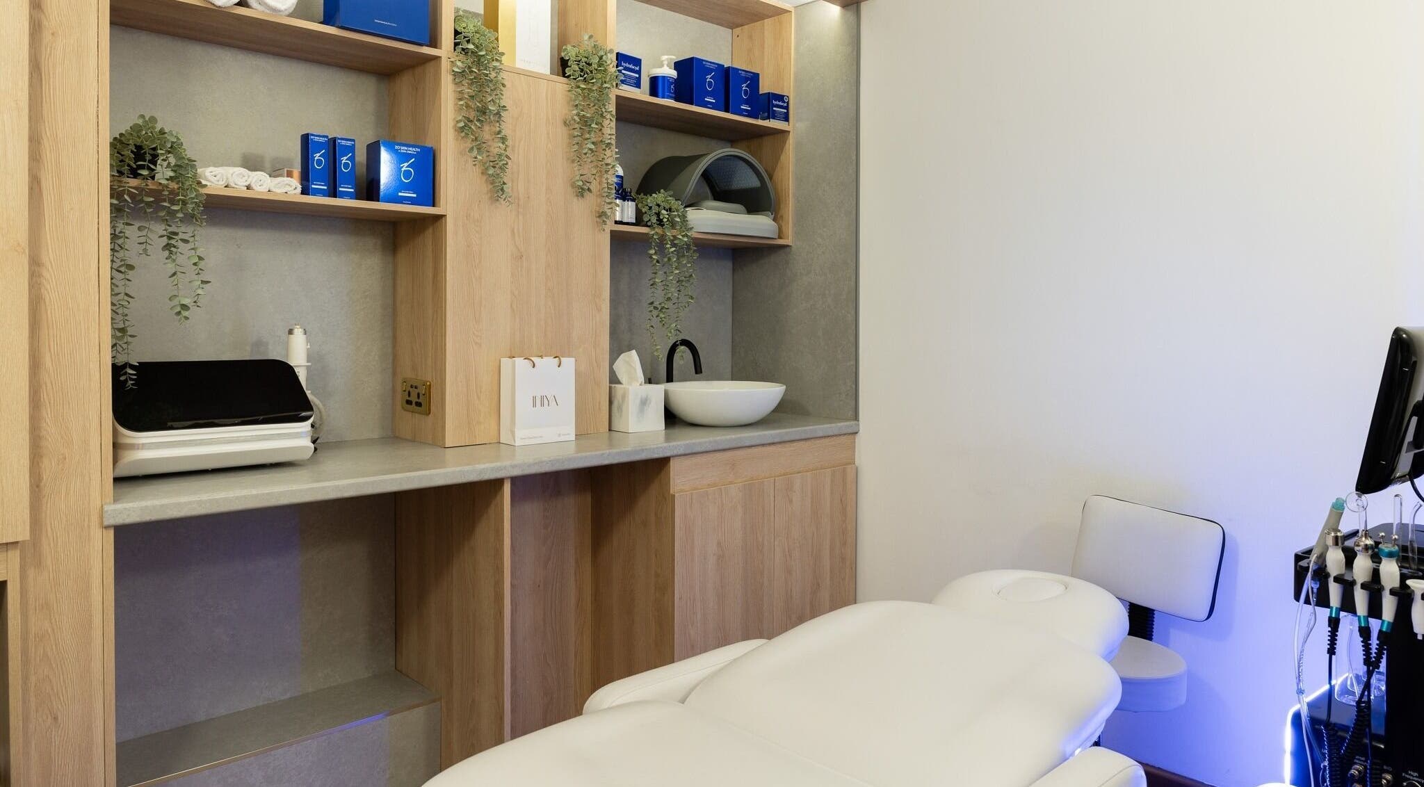 Modern treatment room at INIYA Aesthetics & Laser Clinic, Stanmore, England, GB, featuring sleek decor.