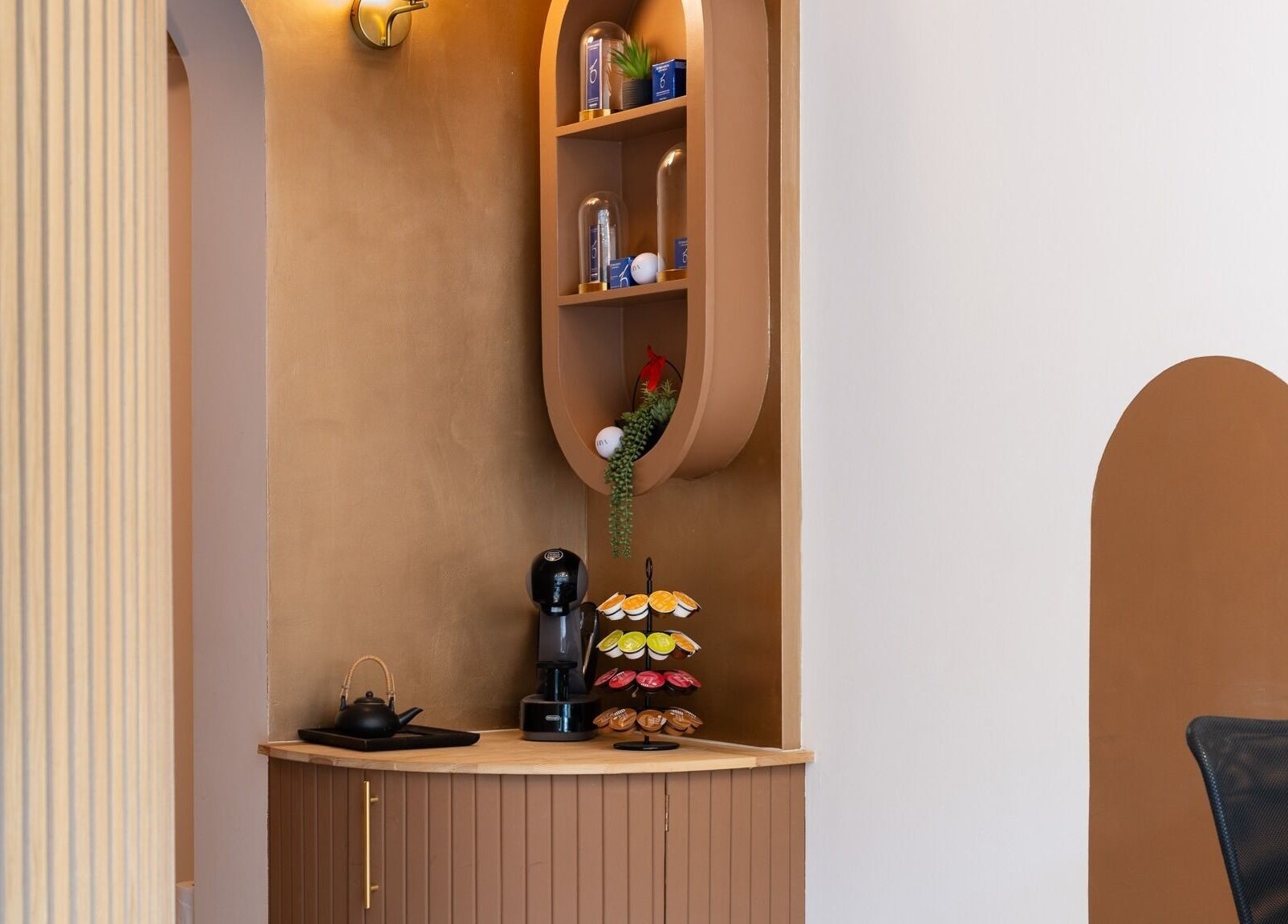 Elegant tea corner at INIYA Aesthetics & Laser Clinic, Stanmore, England, GB featuring stylish decor.