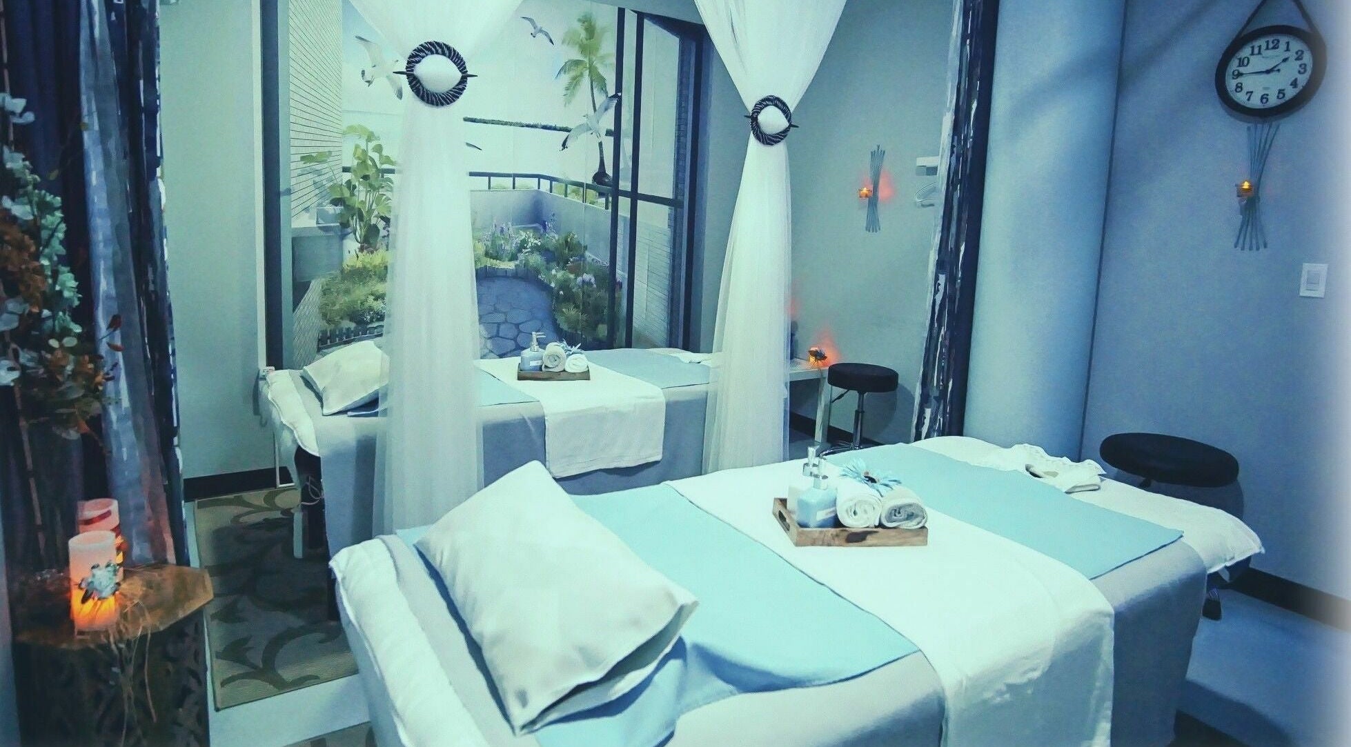 Luxurious massage room at Silver Sea Day Spa, San Jose, California, US featuring serene decor and plush treatment beds.