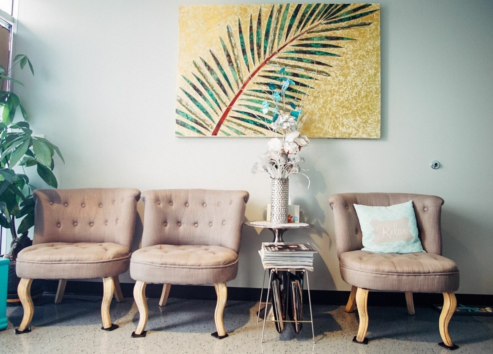 Comfortable seating area at Silver Sea Day Spa in San Jose, California, US with elegant decor and lush plant.